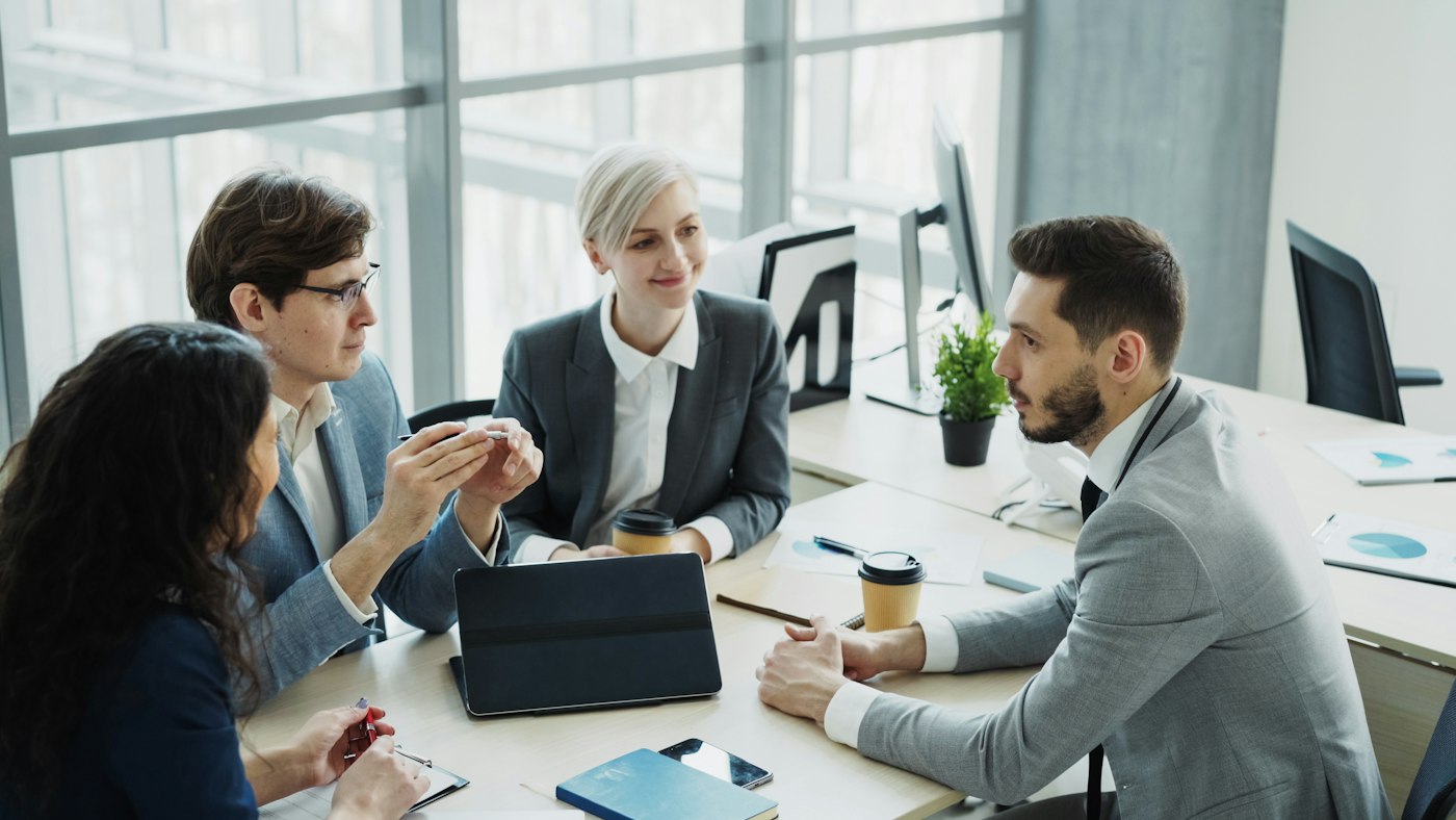 Consultants reviewing a project together around a table