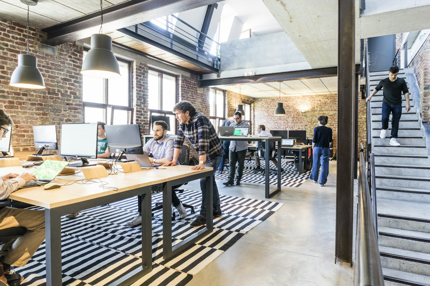 Team working in a modern, light-filled open-plan workplace